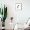 Framed painting of a salmon on the wall