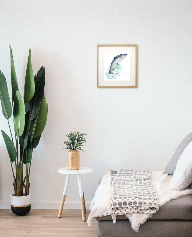 Framed painting of a salmon on the wall
