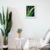 Ladybug painting in frame hanging on a wall