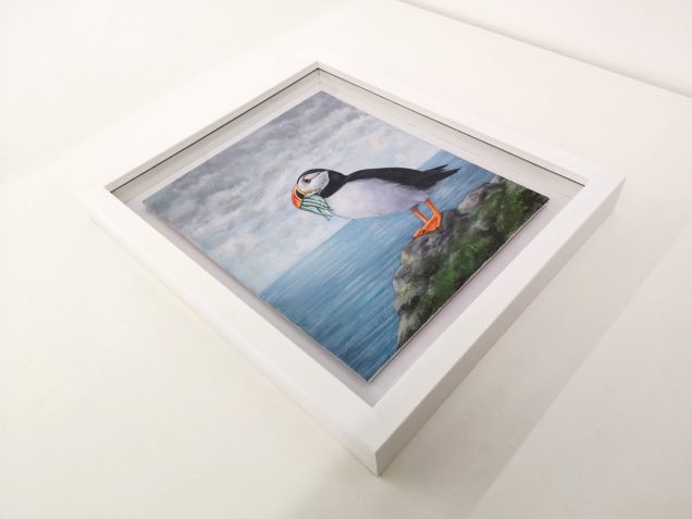 Framed painting of a Puffin
