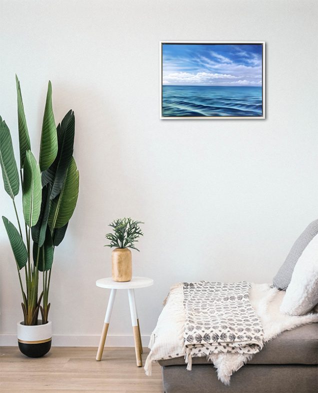 Painting of seascape hanging in a room